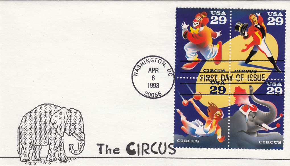 The cachet features a simple black line-art illustration of an adult elephant and a baby elephant on the left side of the white envelope, with the text 'The CIRCUS' printed in a playful mixed-case font beneath them. The block of four 29-cent USA Circus stamps depicts four circus performers on a blu…