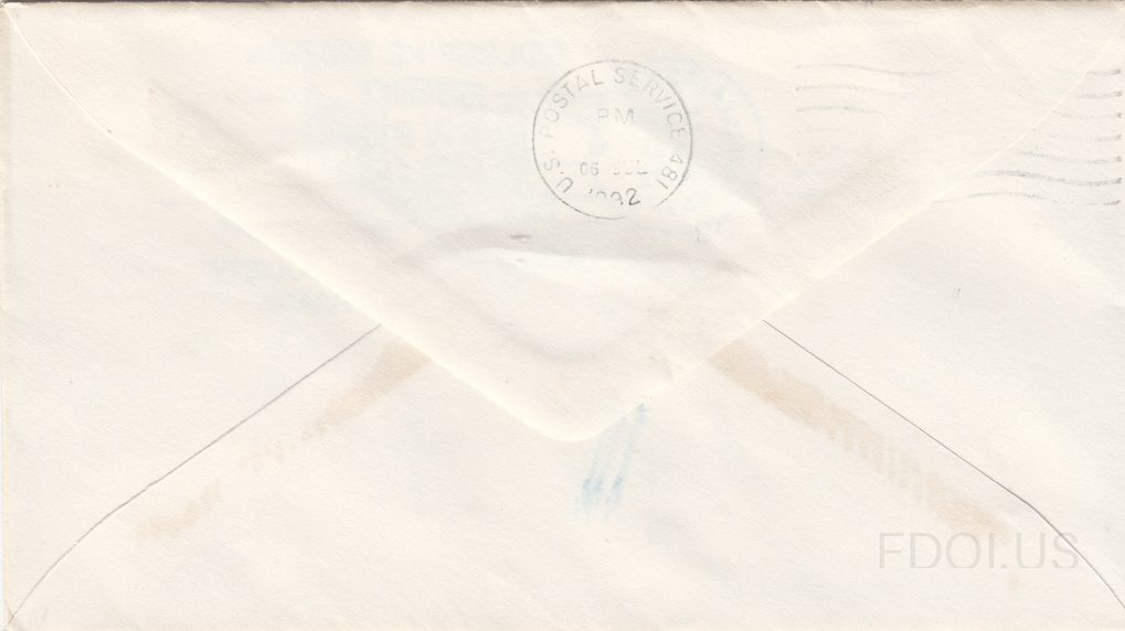This image shows the back of a First Day Cover envelope. The envelope has a standard diamond flap seal on the reverse. A circular U.S. Postal Service transit/backstamp cancellation is visible near the top center. The envelope shows some light aging and minor toning spots. No cachet artwork or stamp…